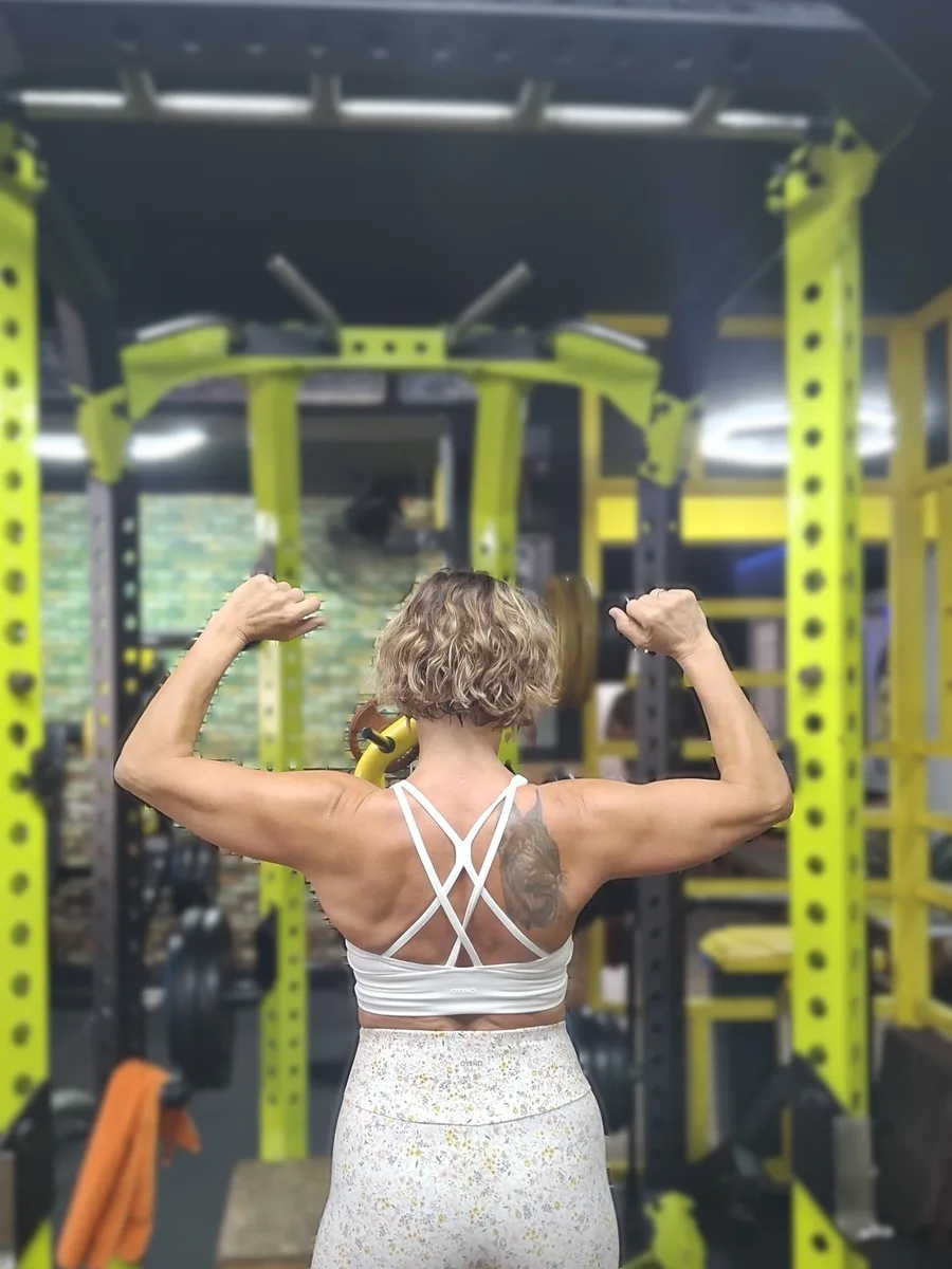 Client result, back double biceps pose