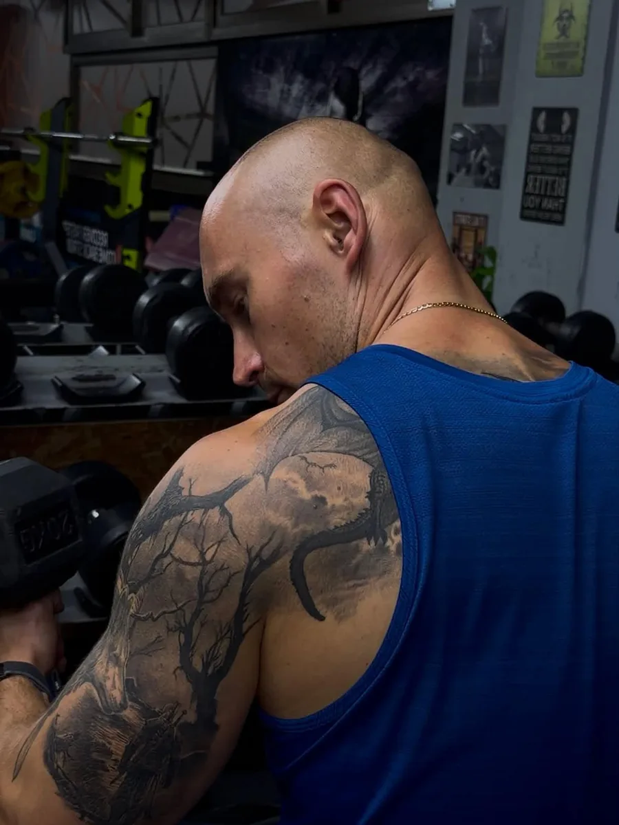 Nikita curling a dumbbell